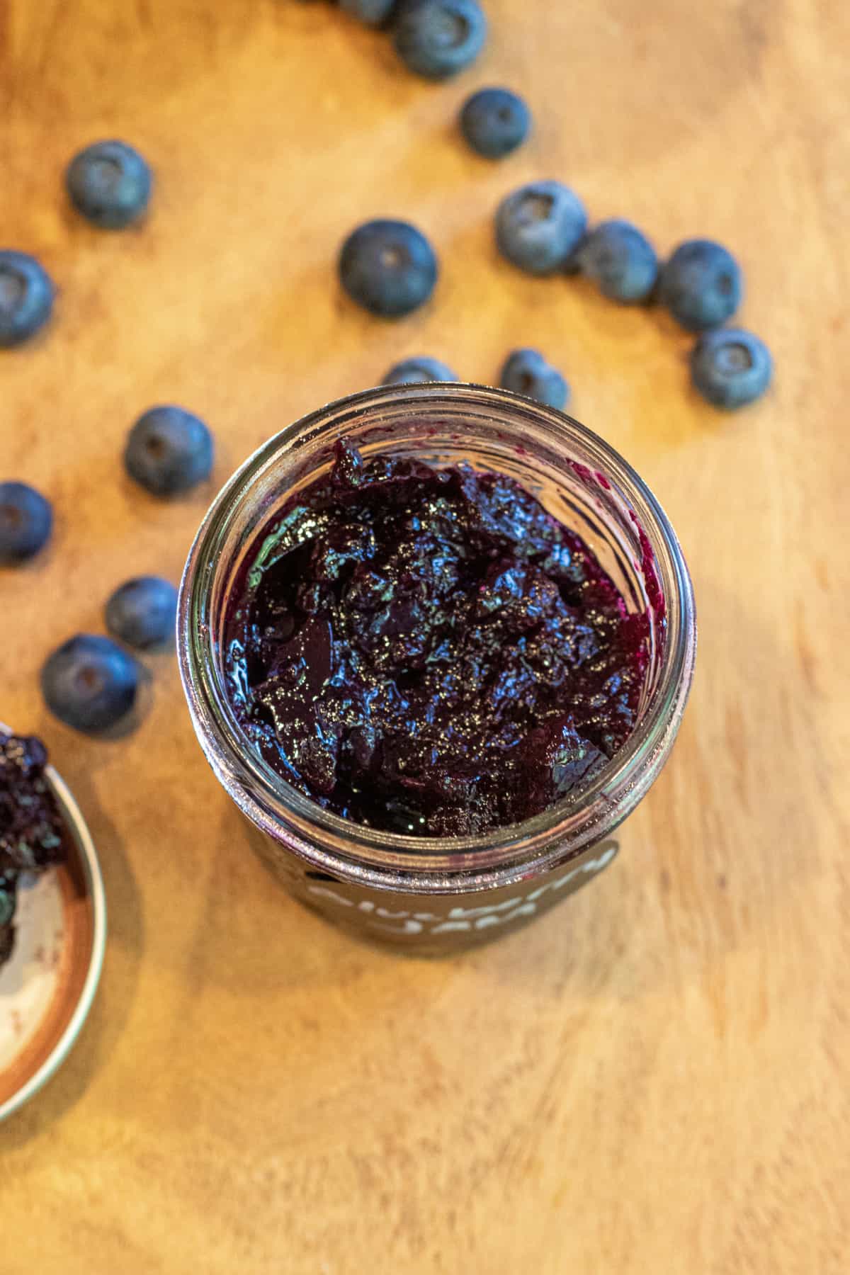 an overhead of an open jar of jam.