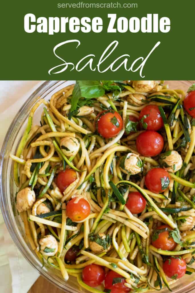 a bowl of zucchini noodles with tomatoes, mozzarella, basil, and balsamic dressing with Pinterest pin text.