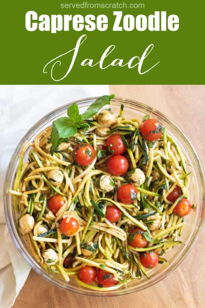 a bowl of zucchini noodles with tomatoes, mozzarella, basil, and balsamic dressing with Pinterest pin text.