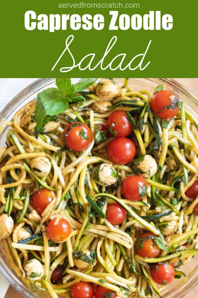a bowl of zucchini noodles with tomatoes, mozzarella, basil, and balsamic dressing with Pinterest pin text.