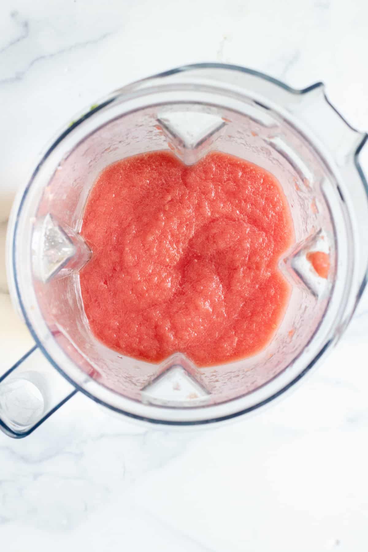 a blender with blended frozen watermelon.