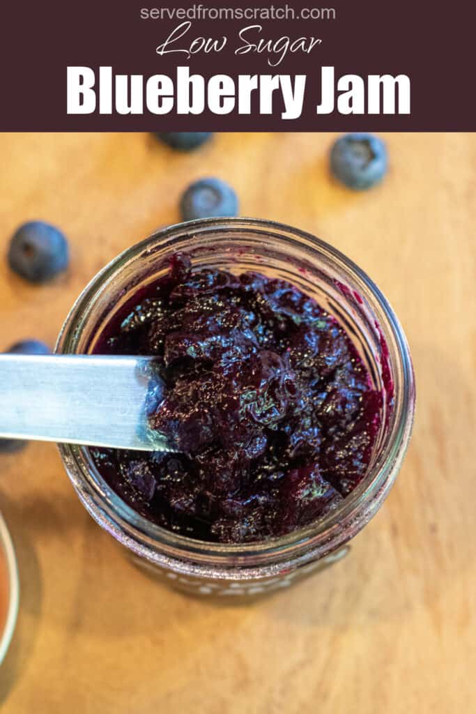 an overhead of an open jar of jam and a knife with Pinterest pin text.