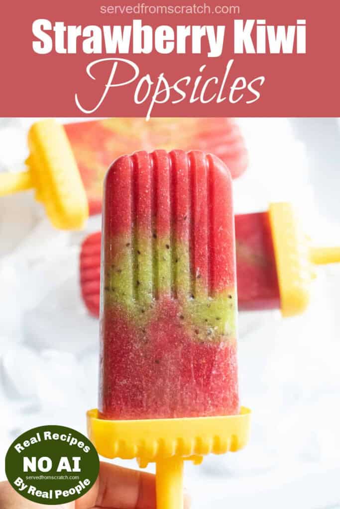 a strawberry and kiwi popsicle held by a hand with Pinterest pin text and NO AI sticker.