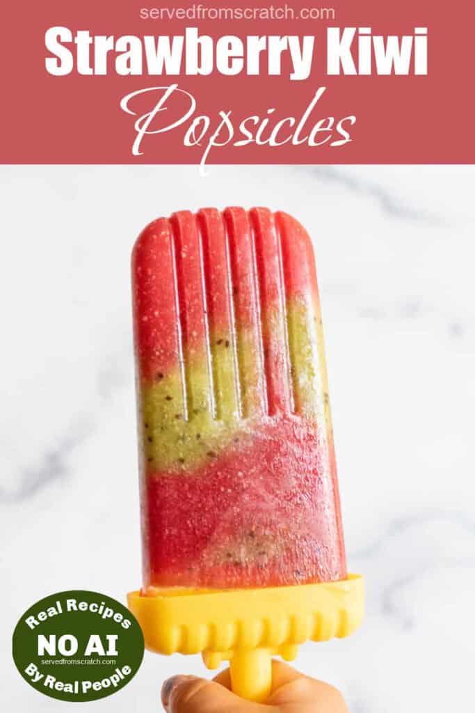 a strawberry and kiwi popsicle held by a hand with Pinterest pin text and NO AI sticker.