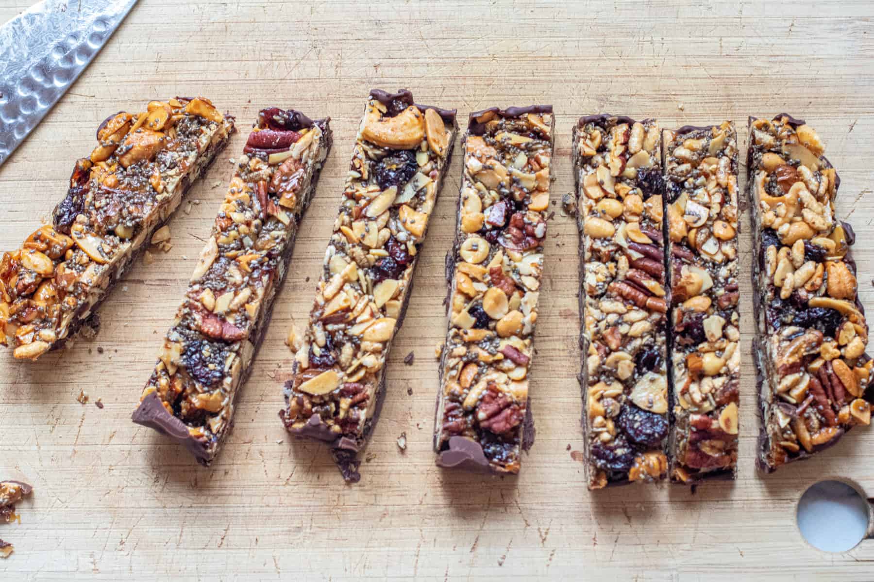 cut trail mix bars on a counter.