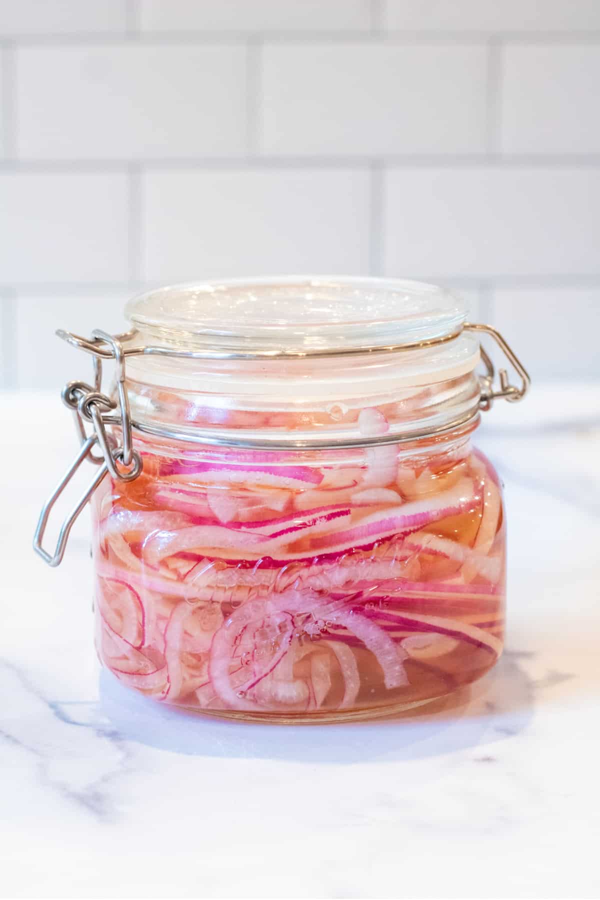 a jar of onions in vinegar.