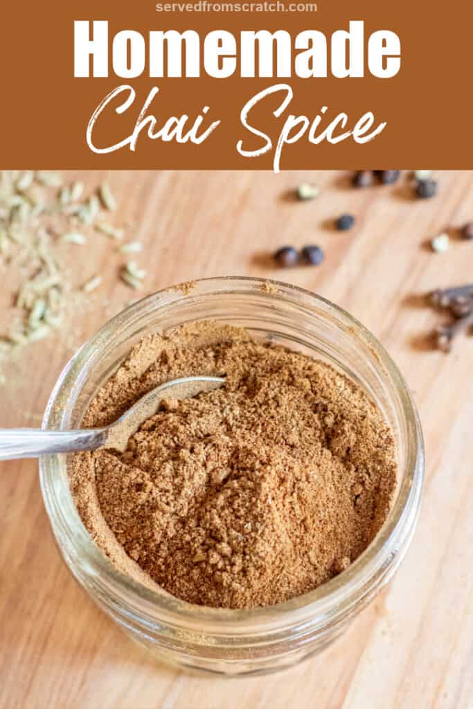 a small mason jar of chai spice with a little spoon with Pinterest pin text.