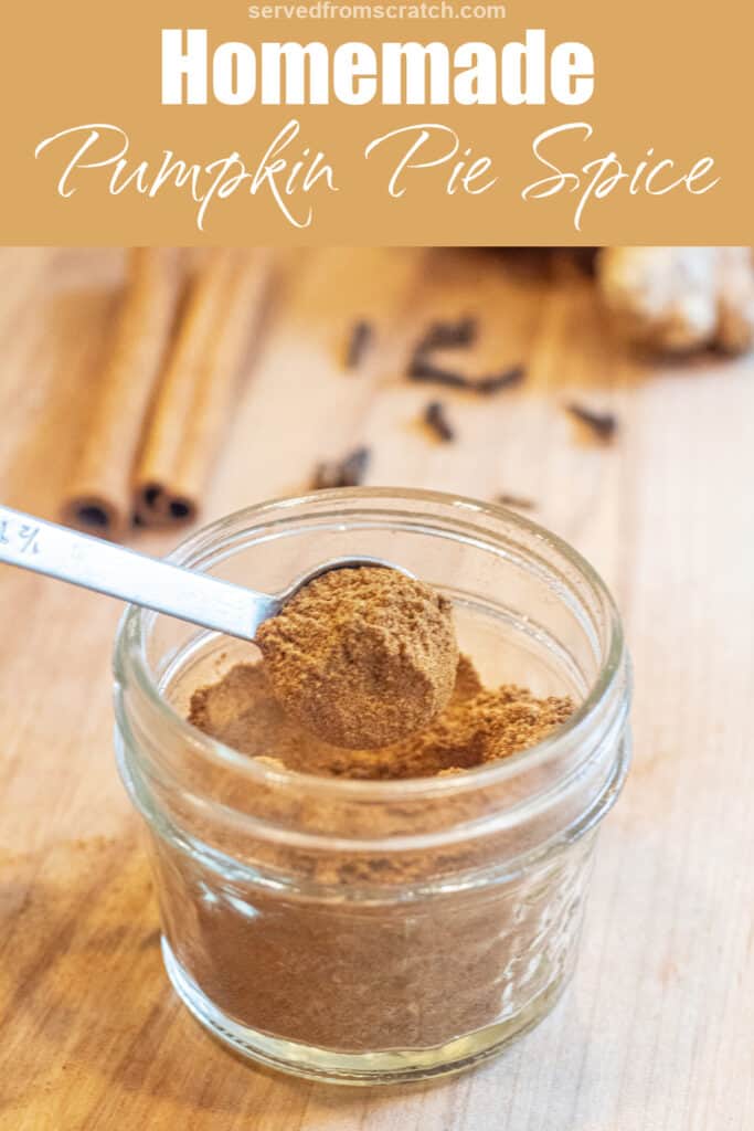 a small mason jar with a measuring spoon with some pumpkin pie spice with Pinterest pin text.