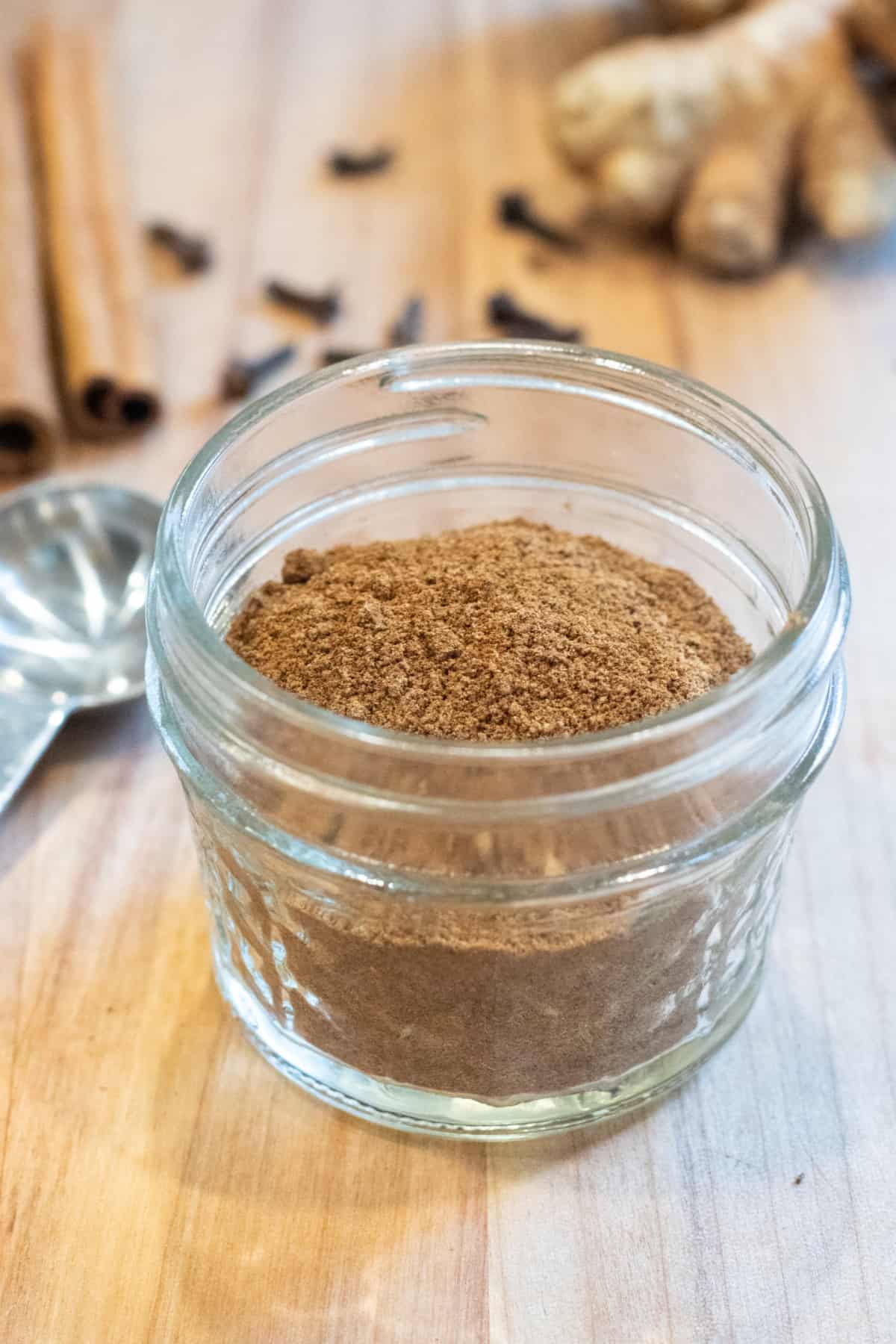 a small mason jar with pumpkin pie spice.