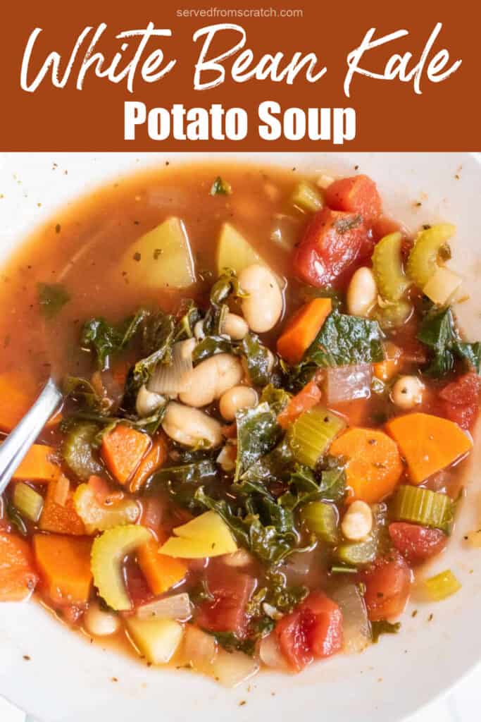 an overhead of a bowl of soup with kale, potatoes, beans, and carrots with a spoon in it with Pinterest pin text.