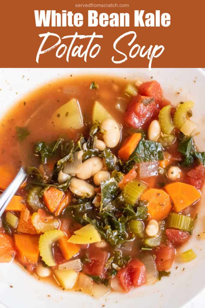 an overhead of a bowl of soup with kale, potatoes, beans, and carrots with a spoon in it with Pinterest pin text.