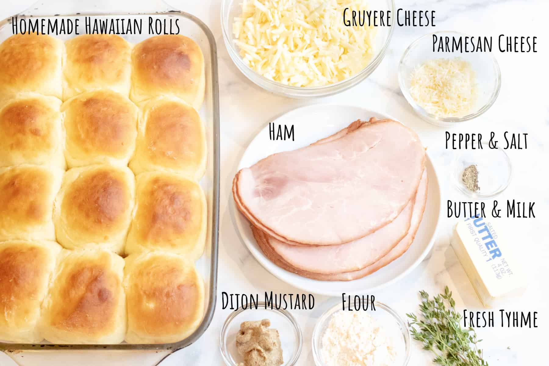 a tray of roll, sliced ham, bowls of cheese, thyme, butter, Dijon, and flour and fresh thyme labeled. 