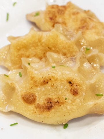 a plate of crispy pierogis.