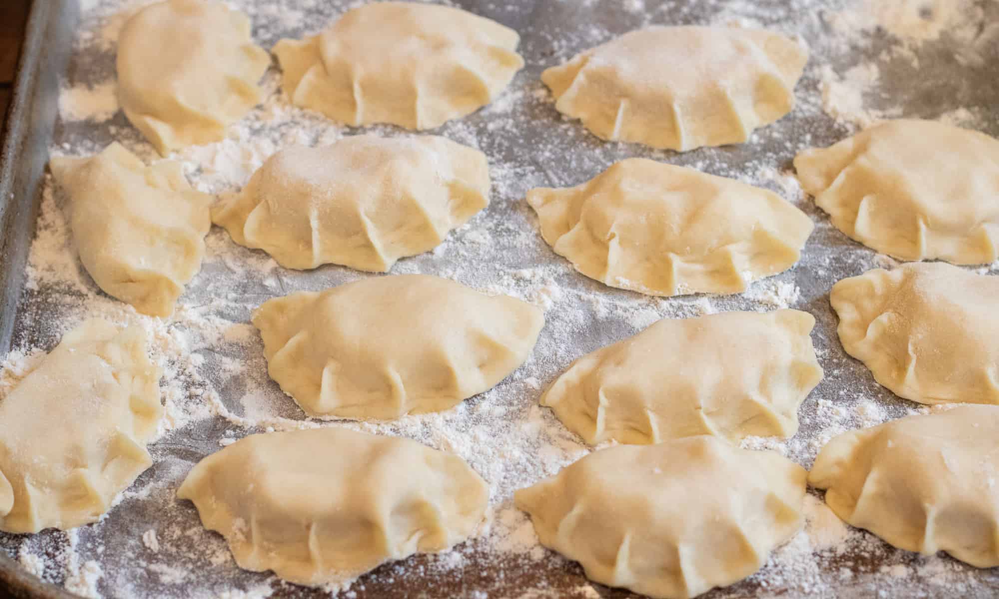 a tray of hand made pierogis.