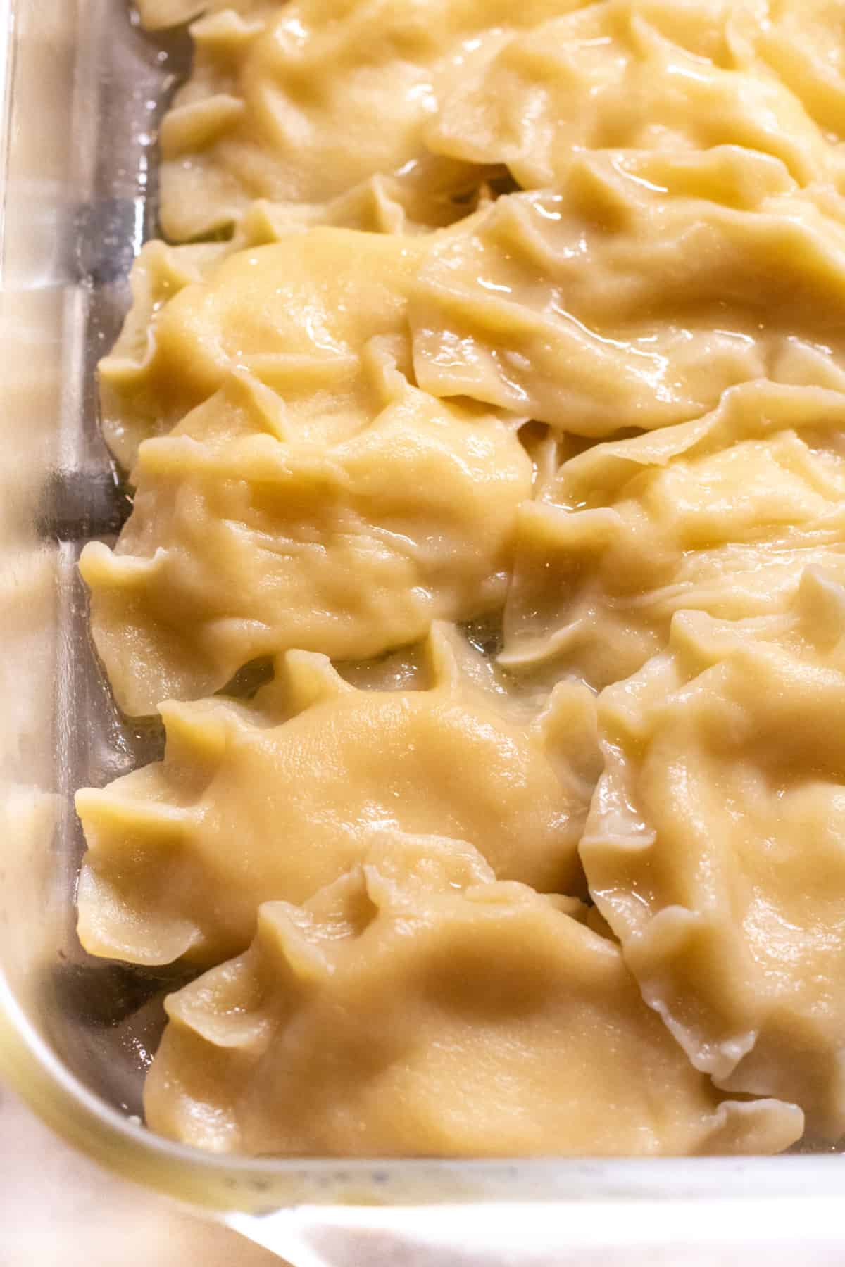 a tray of cooked pierogis.