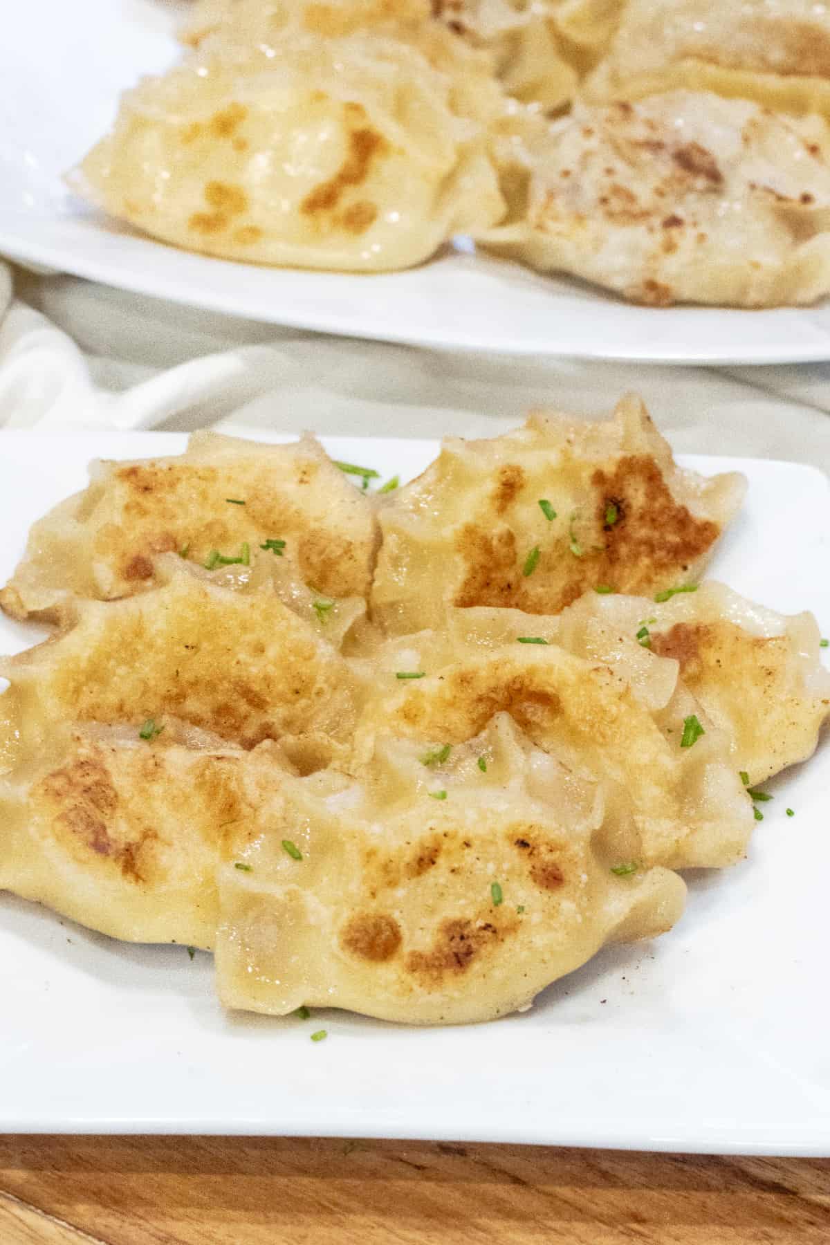 a plate of crispy pierogis.
