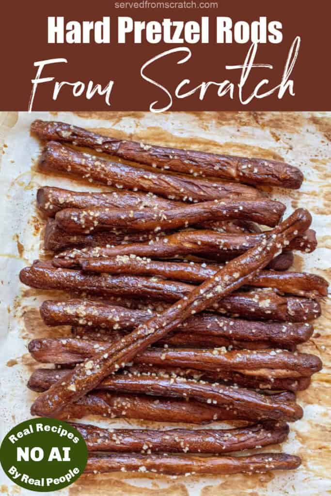 an overhead of a baking tray of hard pretzel rods with Pinterest pin text and NO AI sticker.
