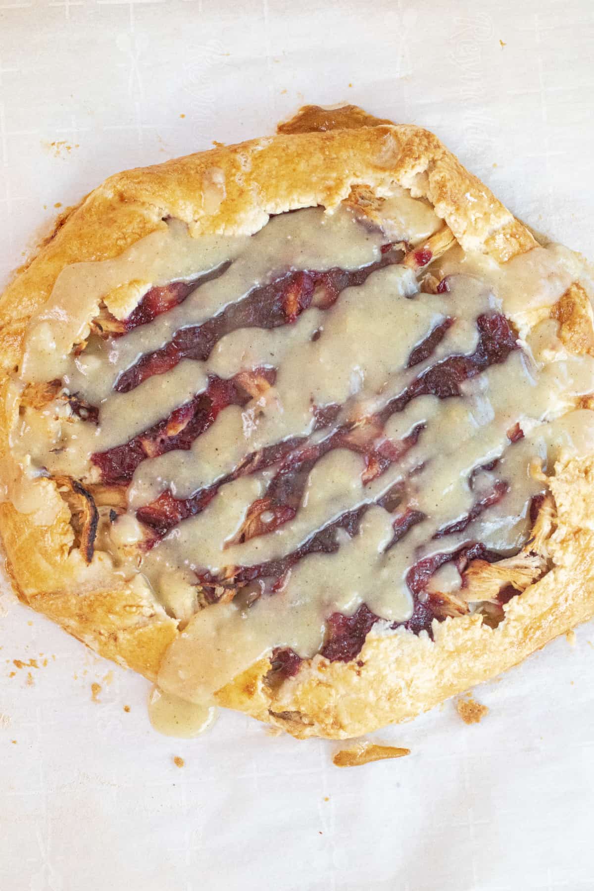 a savory galette with a drizzle of gravy on top.