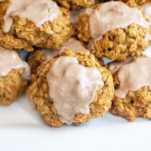 a plate of oatmeal cookies with icing.