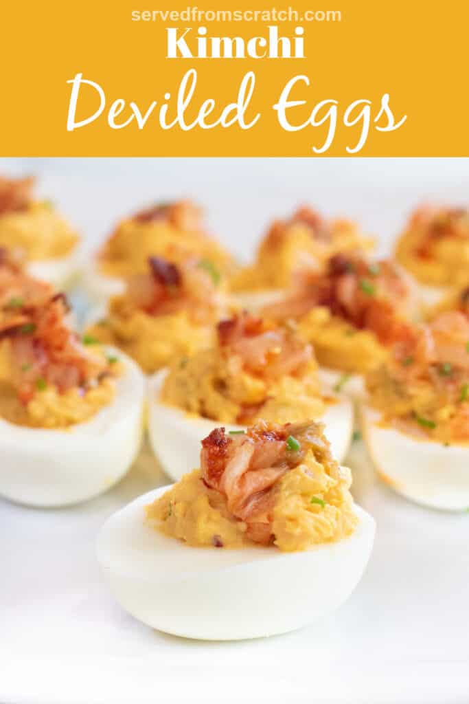 a plate of deviled eggs with kimchi on the top with Pinterest pin text.