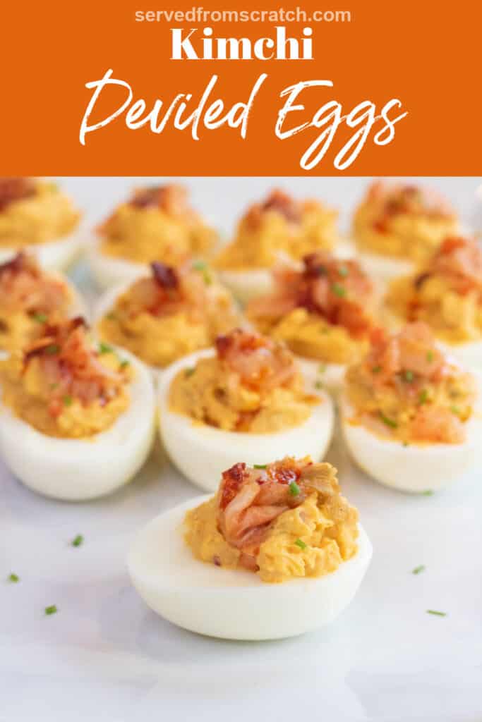 a plate of deviled eggs with kimchi on the top with Pinterest pin text.
