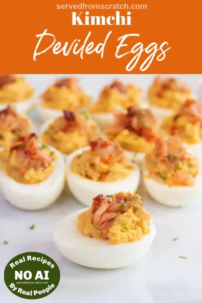 a plate of deviled eggs with kimchi on the top with Pinterest pin text with NO AI sticker.