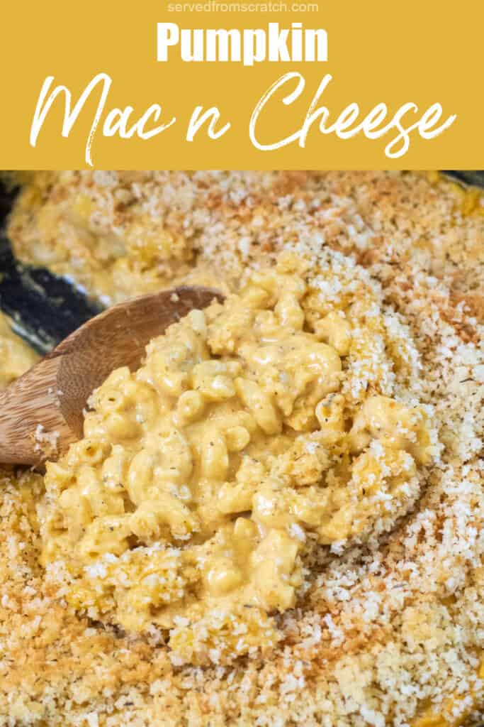 a spoon of mac n cheese in a skillet with Pinterest pin text.