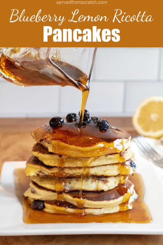 a stack of pancakes with blueberries and syrup being poured over it with Pinterest pin text.