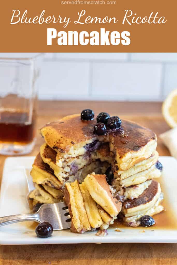 a large stack of pancakes with a fork of pancakes taken out with a fork on with PInterest pin text.