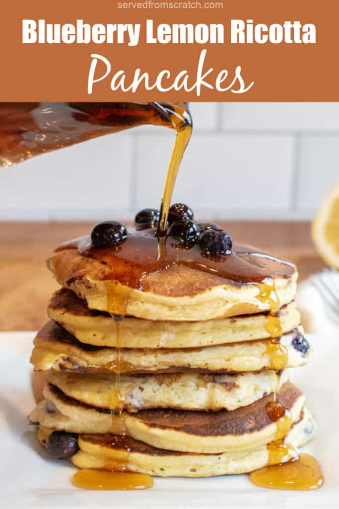 a stack of pancakes with blueberries and syrup being poured over it with Pinterest pin text.