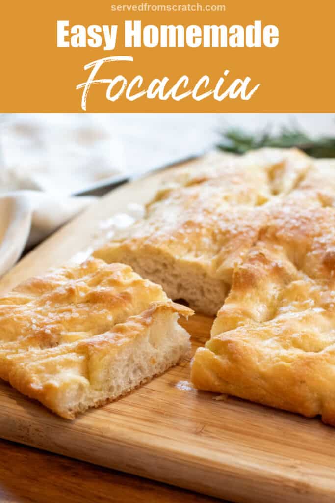 a focaccia on a cutting board with a piece cut out Pinterest pin text.