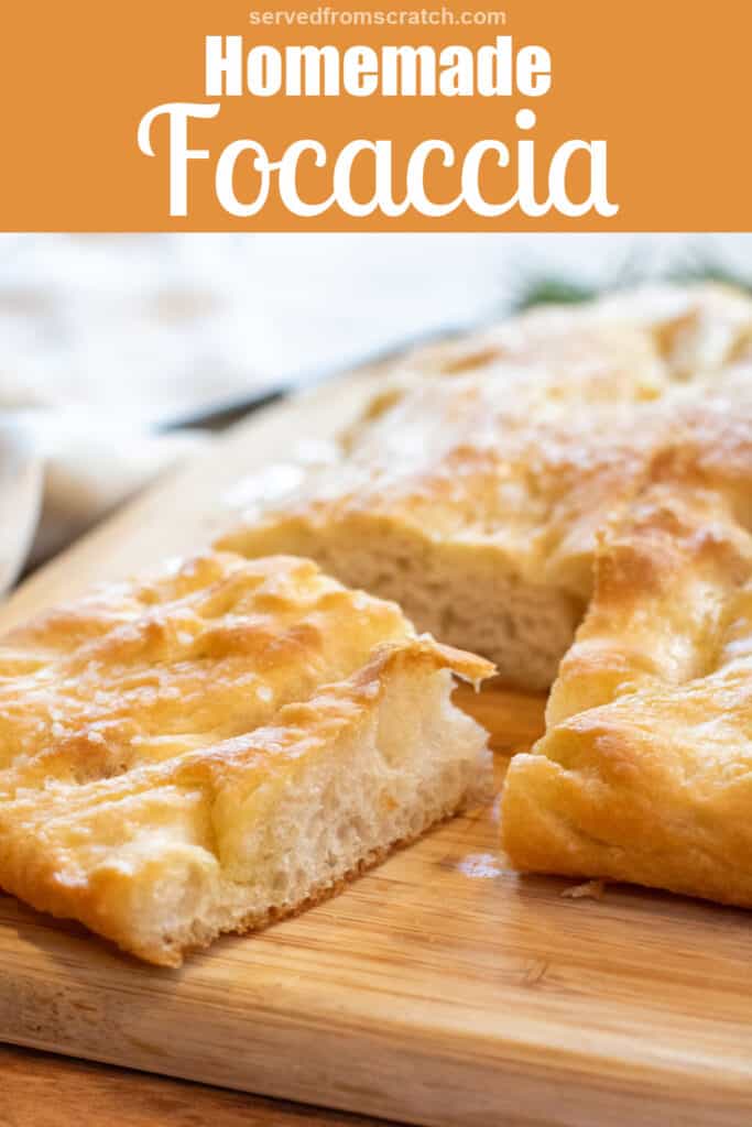 a focaccia on a cutting board with a piece cut out Pinterest pin text.