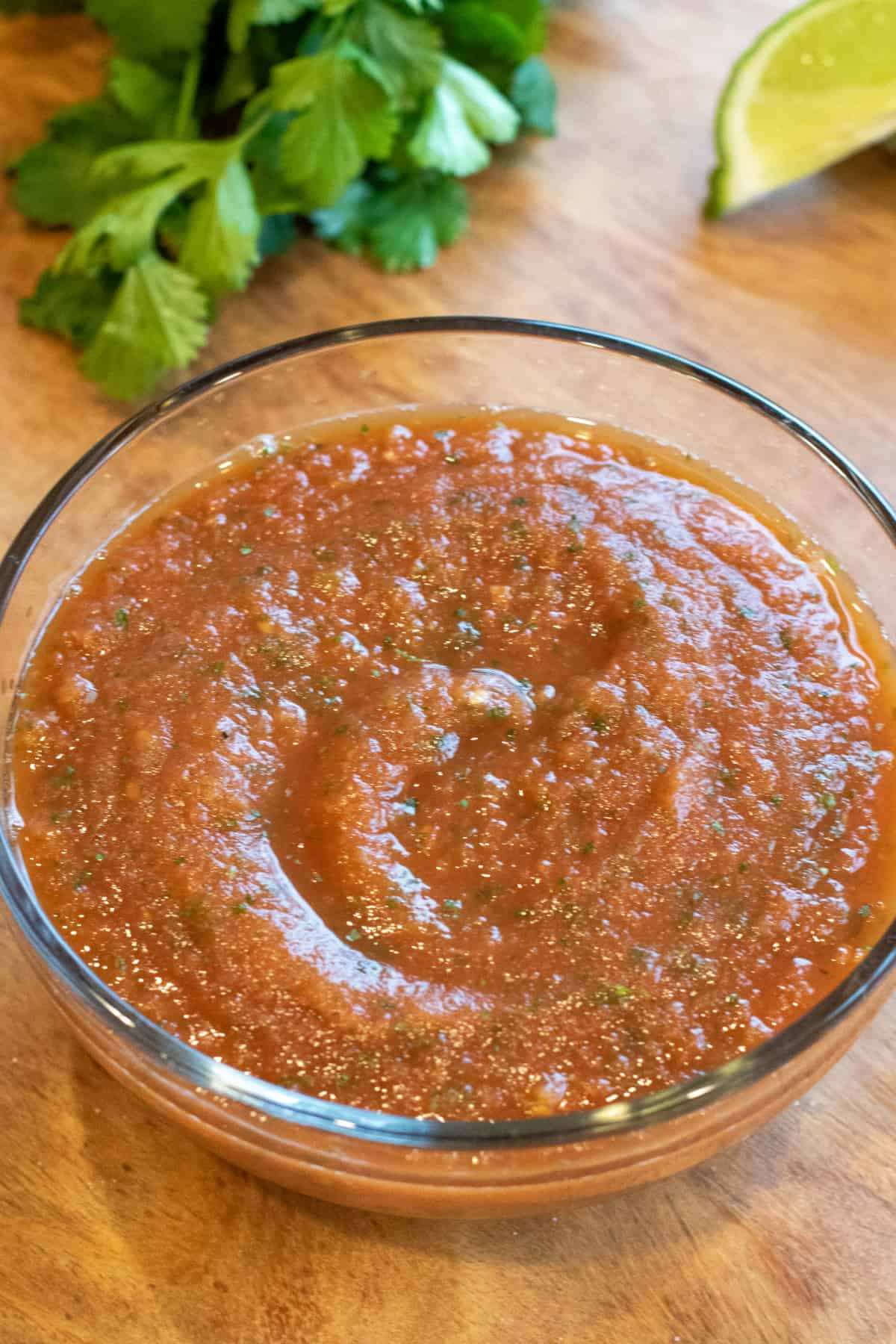 a bowl of smooth tomato salsa.