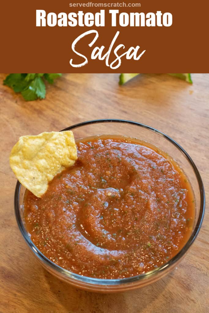 a bowl of smooth tomato salsa with a chip in it with Pinterest pin text.