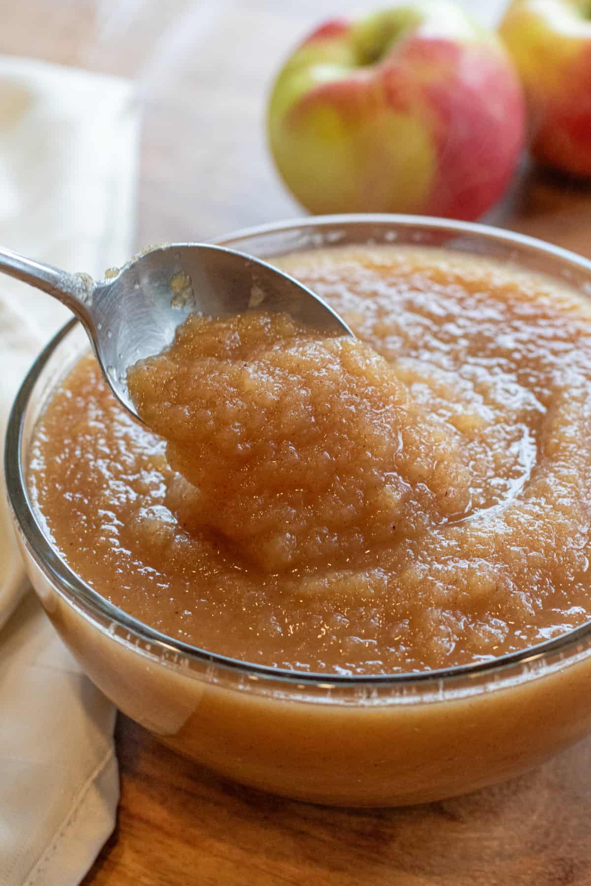 a big bowl of applesauce with a spoon.