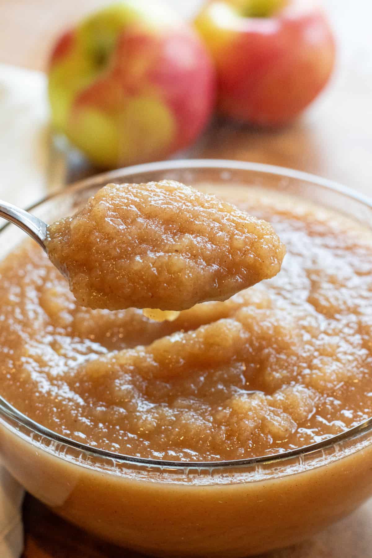 a big bowl of applesauce with a spoon.