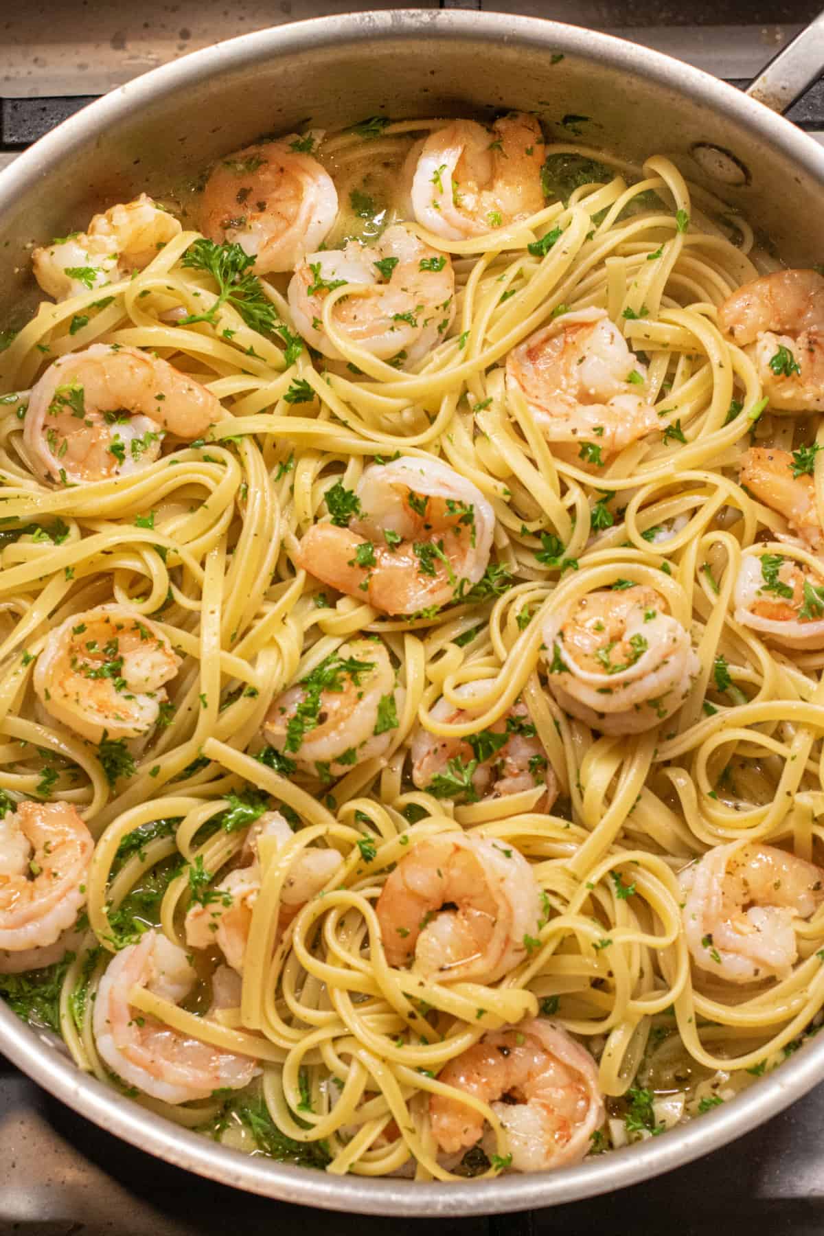 an overhead of a pan of shrimp scampi.