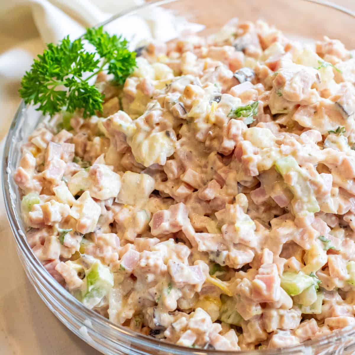 a close up of a bowl of ham salad.