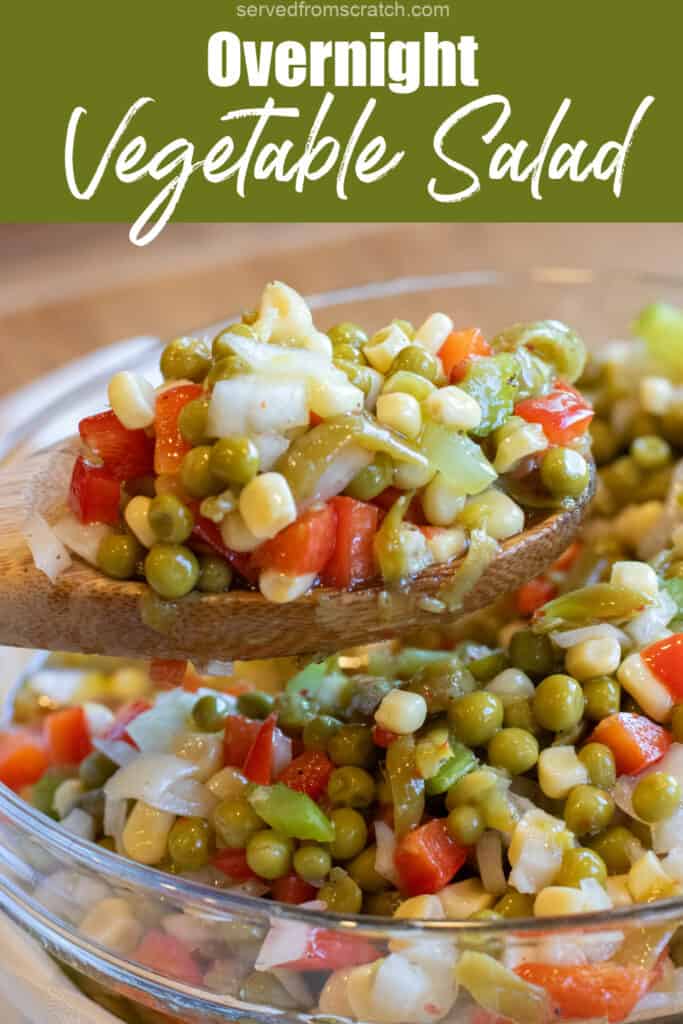 a wooden spoon holding up some vegetable salad with corn, peas, red pepper, and onion with Pinterest pin text.