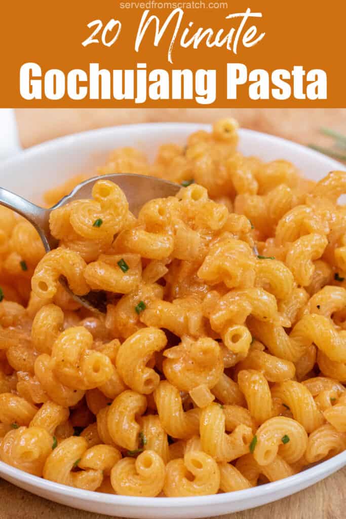 a bowl of creamy pasta with a spoon in it and Pinterest pin text.
