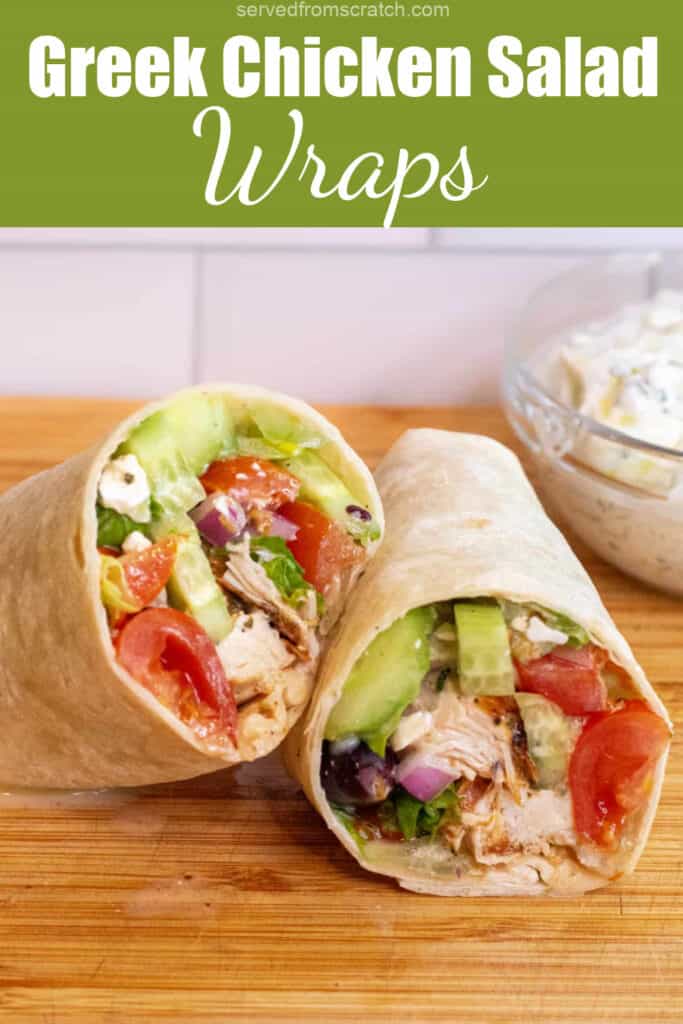 a halved chicken and greek salad wrap on a cutting board with Pinterest pin text.