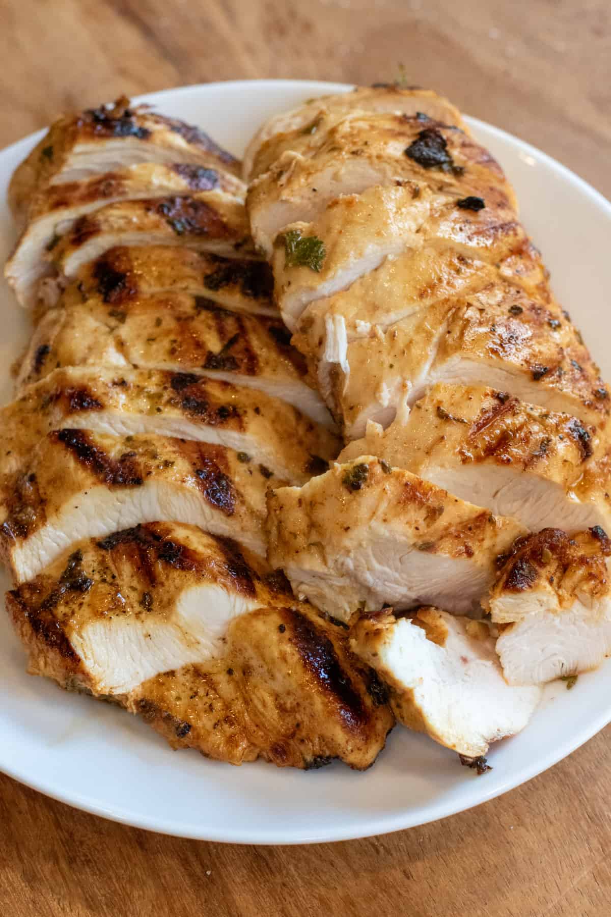 grilled chicken sliced on a plate.