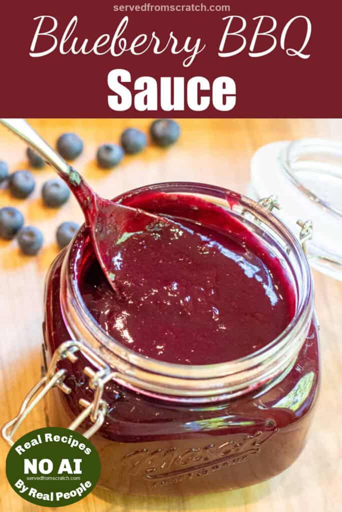 an open mason jar with a spoon and blueberry bbq sauce with Pinterest pin text with NO AI sticker.