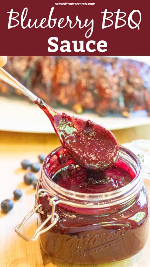 an open mason jar with a spoon and blueberry bbq sauce with Pinterest pin text.