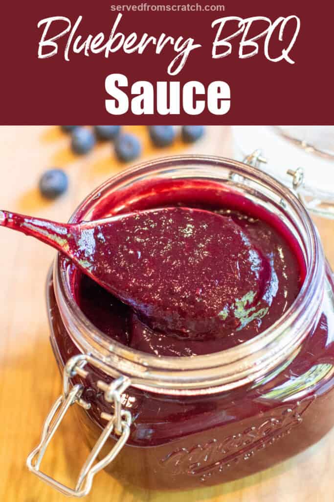an open mason jar with a spoon and blueberry bbq sauce with Pinterest pin text.