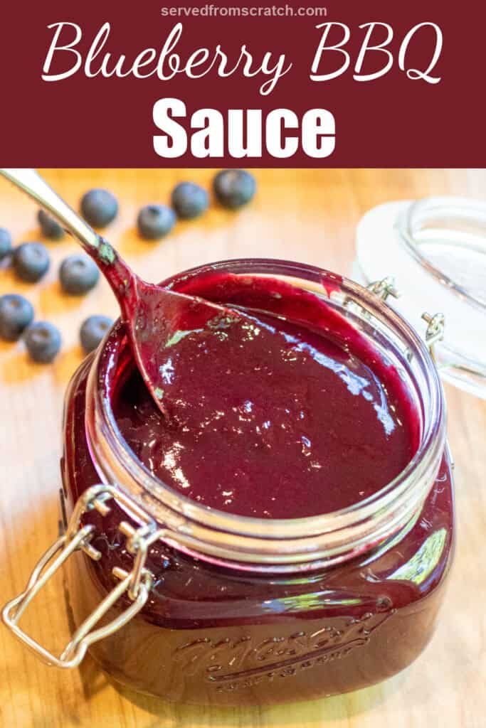 an open mason jar with a spoon and blueberry bbq sauce with Pinterest pin text.