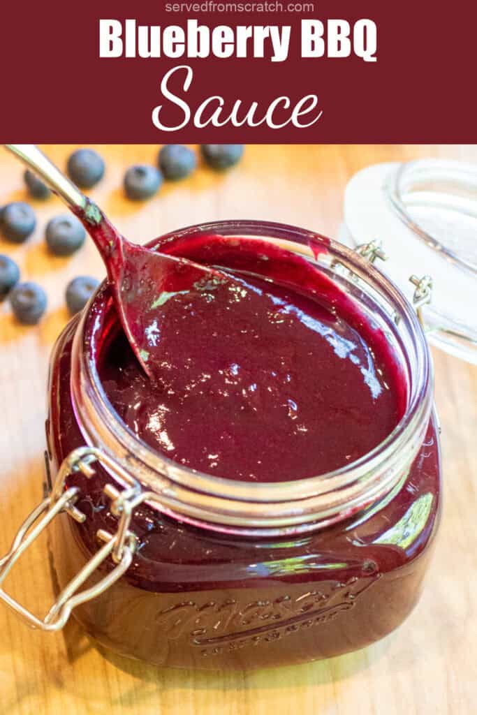 an open mason jar with a spoon and blueberry bbq sauce with Pinterest pin text.