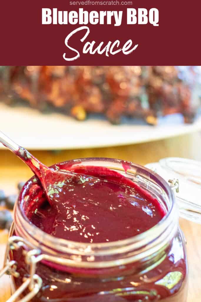 an open mason jar with a spoon and blueberry bbq sauce with Pinterest pin text.