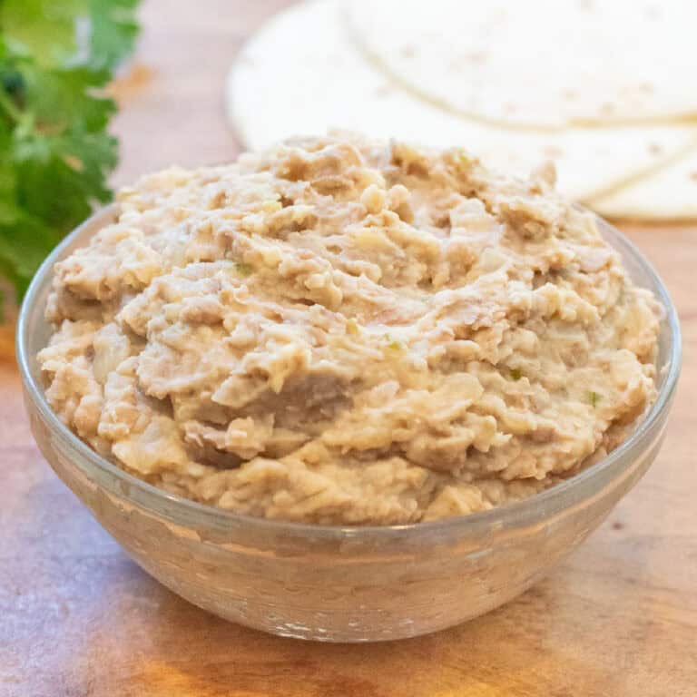 a bowl of refried beans.