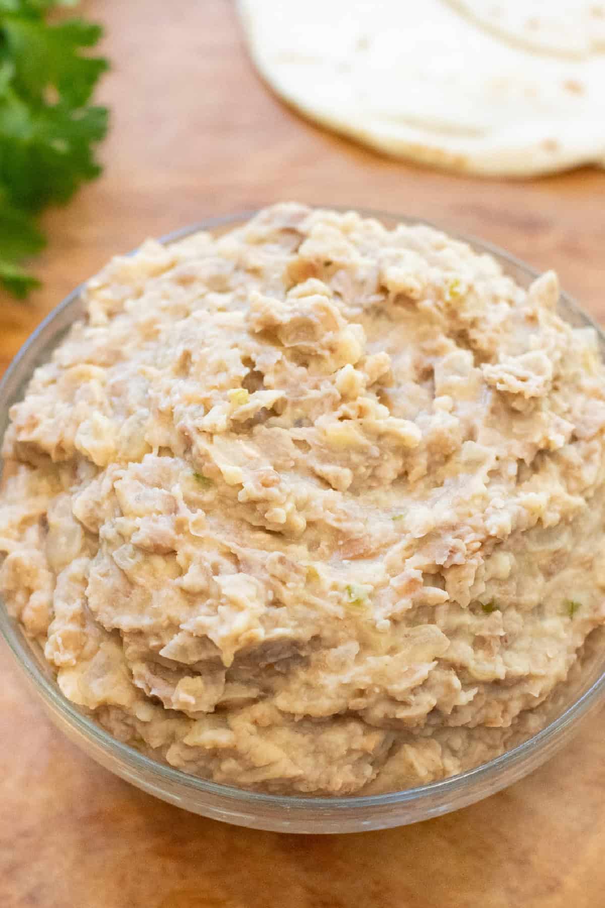 a bowl of refried beans.